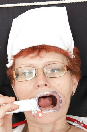 Mature obgyn nurse in glasses and
