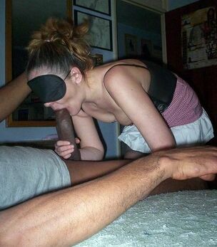 Dark-hued masseur rubs an older..
